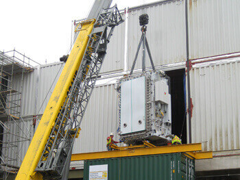 Crane providing millwright services at a job site.